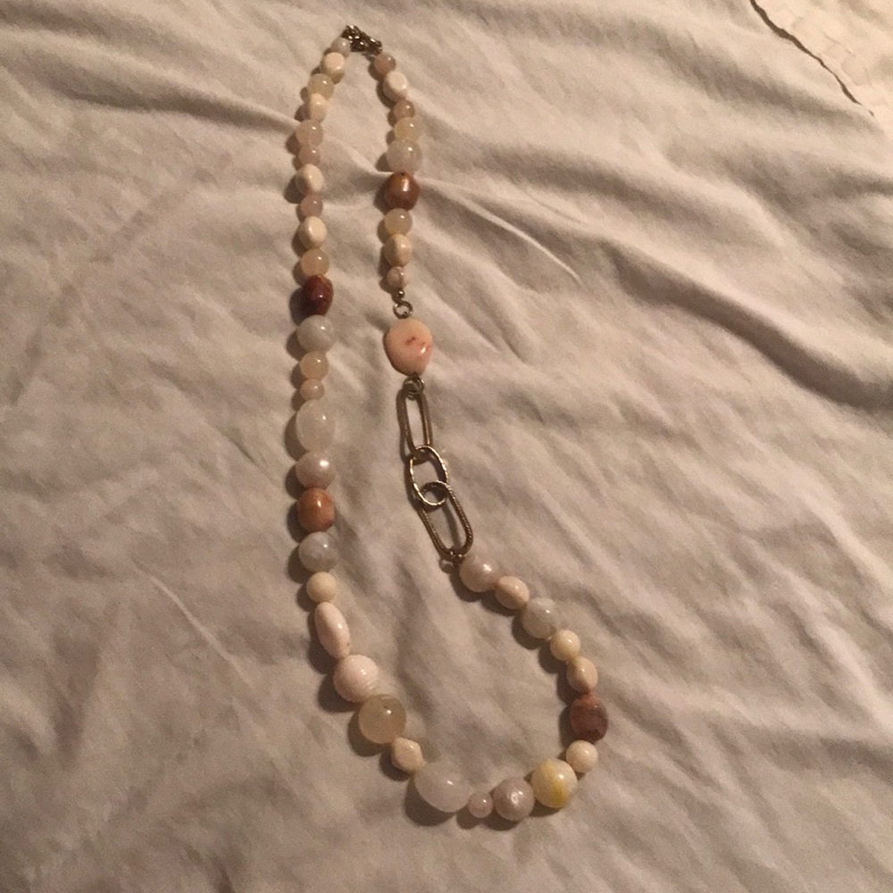 Beaded necklace with adjustable length closure.